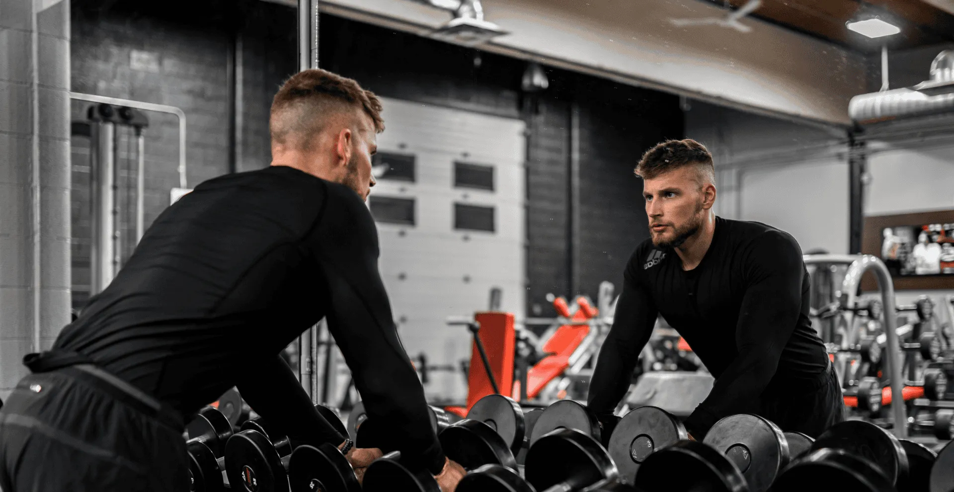 Rob Lancsak personal trainer working with client in home gym